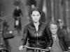 Young and pretty on a bicycle in Amsterdam